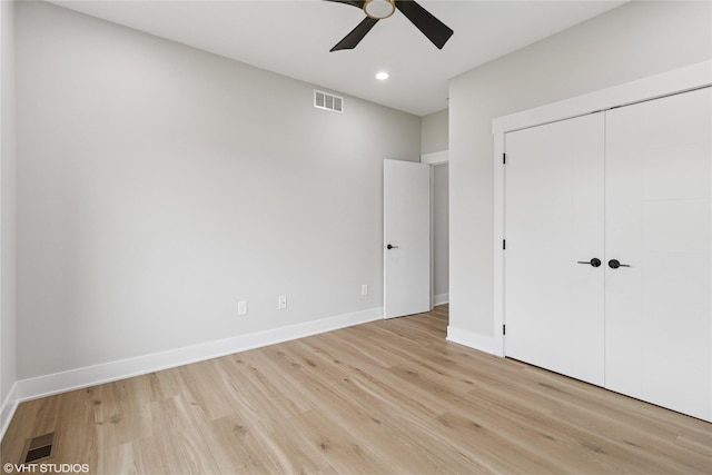 17400 Springbrook Trl, Urbandale, IA 50111 - unfurnished bedroom featuring light wood-style floors, baseboards, a closet, recessed lighting, and ceiling fan