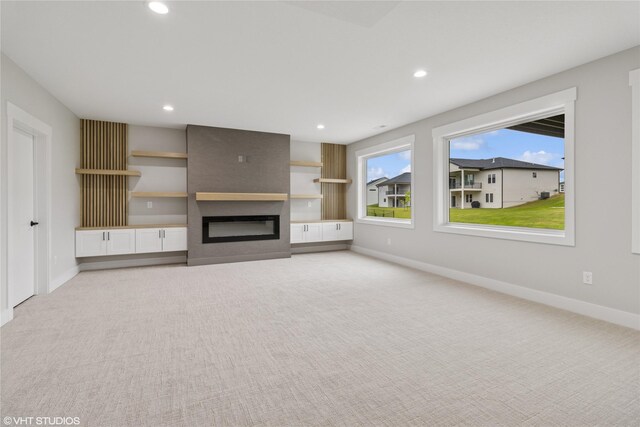 17400 Springbrook Trl, Urbandale, IA 50111 - unfurnished living room featuring light carpet, recessed lighting, baseboards, and a fireplace