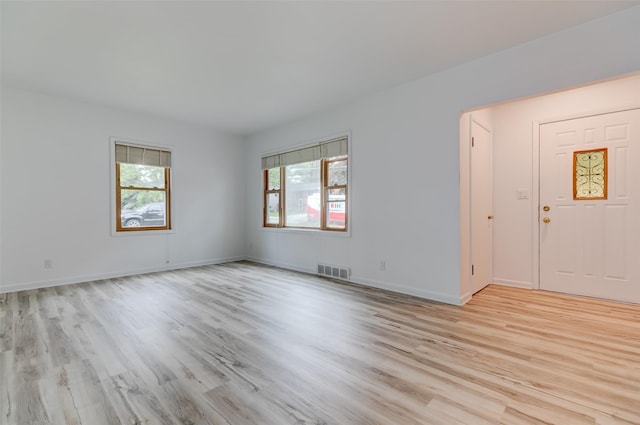 4007 68th St, Urbandale, IA 50322 - unfurnished room featuring healthy amount of natural light, light wood-type flooring, and baseboards