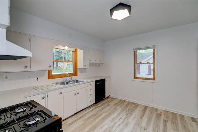 4007 68th St, Urbandale, IA 50322 - kitchen featuring a sink, black appliances, extractor fan, light wood finished floors, and light countertops