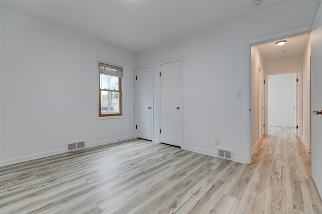 4007 68th St, Urbandale, IA 50322 - unfurnished bedroom featuring light wood finished floors and baseboards