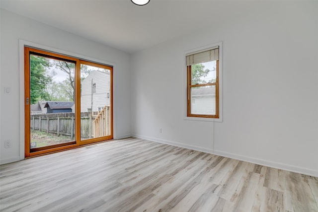 4007 68th St, Urbandale, IA 50322 - spare room with wood finished floors and baseboards