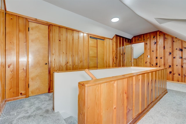 4007 68th St, Urbandale, IA 50322 - bonus room with carpet flooring, vaulted ceiling, and wood walls