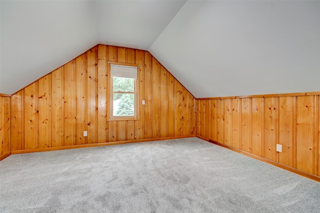 4007 68th St, Urbandale, IA 50322 - bonus room featuring lofted ceiling, carpet floors, and wood walls
