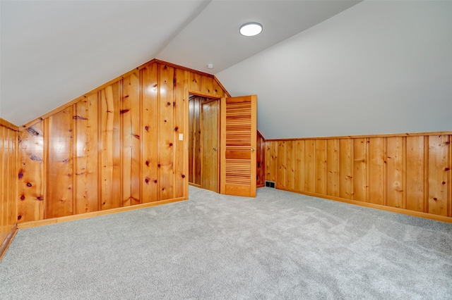 4007 68th St, Urbandale, IA 50322 - bonus room with lofted ceiling, wood walls, and carpet