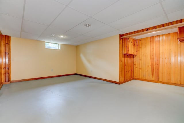 4007 68th St, Urbandale, IA 50322 - basement with wooden walls, baseboards, and a drop ceiling