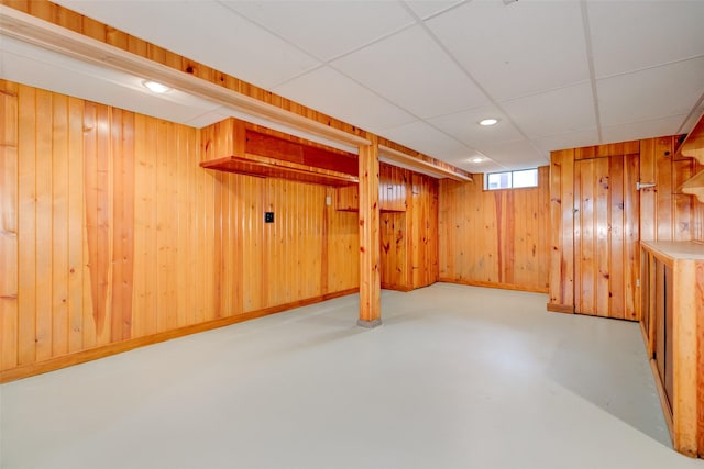 4007 68th St, Urbandale, IA 50322 - below grade area with a paneled ceiling, wooden walls, and recessed lighting