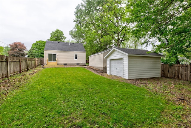 4007 68th St, Urbandale, IA 50322 - rear view of property with an outbuilding and a garage