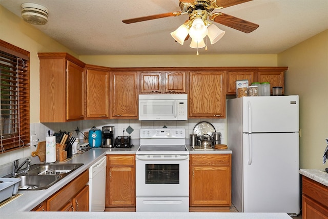 1236 63rd St, Windsor Heights, IA 50324 - kitchen featuring white appliances, a sink, decorative backsplash, a ceiling fan, and brown cabinets