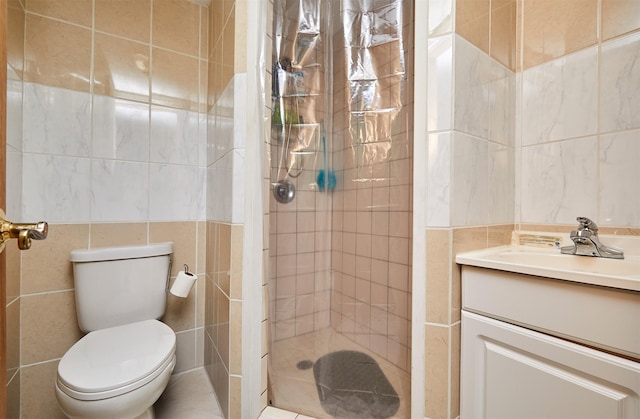 1236 63rd St, Windsor Heights, IA 50324 - full bath featuring tile walls, a stall shower, vanity, and toilet