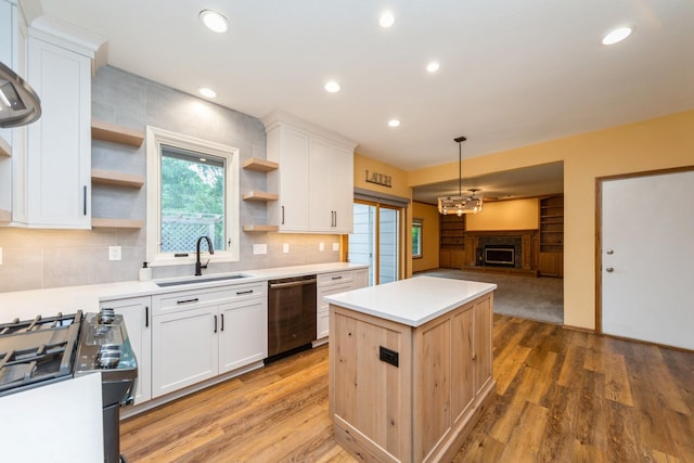 2230 NW 138th St, Clive, IA 50325 - kitchen with a sink, open shelves, appliances with stainless steel finishes, a kitchen island, and white cabinets