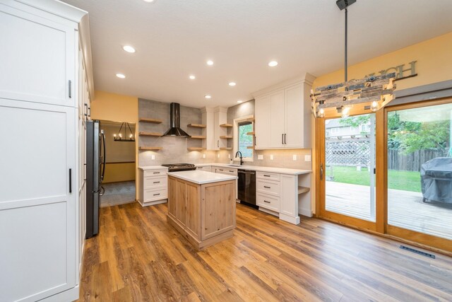 2230 NW 138th St, Clive, IA 50325 - kitchen with open shelves, dishwashing machine, a center island, light countertops, and freestanding refrigerator