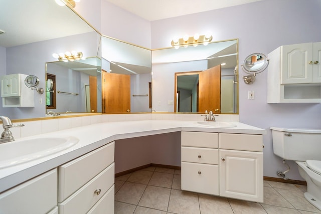 2230 NW 138th St, Clive, IA 50325 - bathroom with double vanity, toilet, tile patterned floors, and a shower