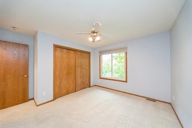 2230 NW 138th St, Clive, IA 50325 - unfurnished bedroom with a closet, carpet flooring, and baseboards