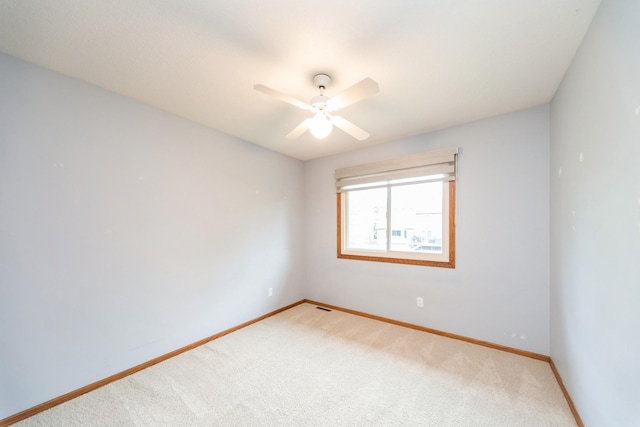 2230 NW 138th St, Clive, IA 50325 - unfurnished room featuring light carpet, baseboards, and ceiling fan