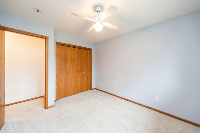 2230 NW 138th St, Clive, IA 50325 - unfurnished bedroom with carpet flooring, baseboards, and a ceiling fan