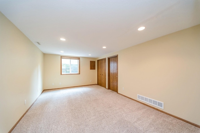 2230 NW 138th St, Clive, IA 50325 - empty room with light colored carpet, recessed lighting, and baseboards