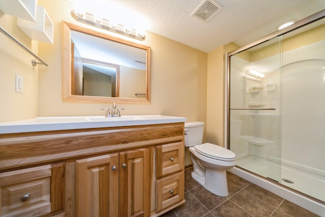 2230 NW 138th St, Clive, IA 50325 - full bath with tile patterned floors, toilet, vanity, a stall shower, and a textured ceiling