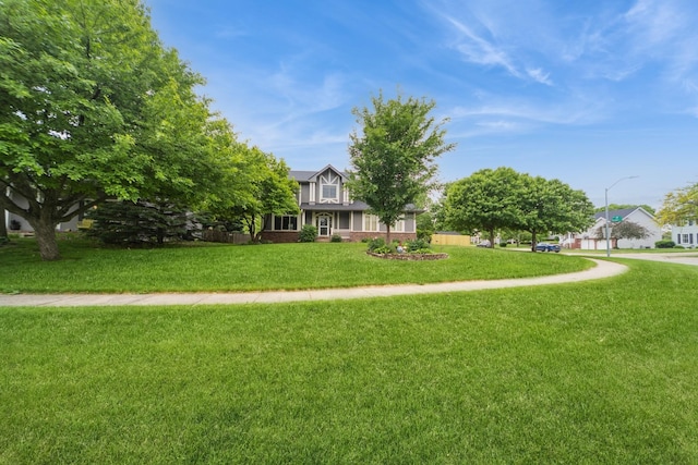 2230 NW 138th St, Clive, IA 50325 - view of property hidden behind natural elements with a front yard