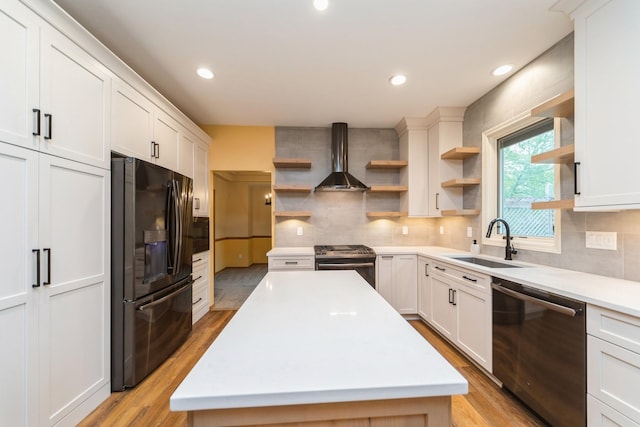2230 NW 138th St, Clive, IA 50325 - kitchen with open shelves, stainless steel appliances, a sink, wall chimney exhaust hood, and light wood-style flooring