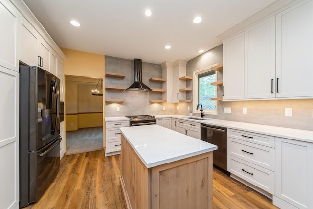 2230 NW 138th St, Clive, IA 50325 - kitchen with stainless steel appliances, open shelves, wall chimney range hood, a sink, and light wood finished floors