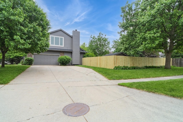 2230 NW 138th St, Clive, IA 50325 - view of home's exterior featuring driveway, an attached garage, and a chimney