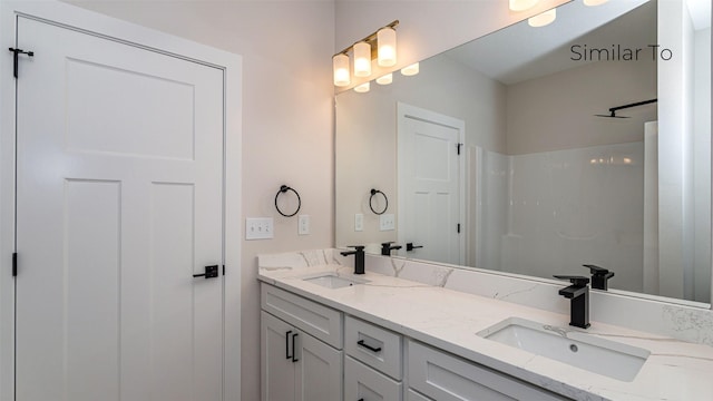 610 NW Georgetown Dr, Waukee, IA 50263 - bathroom featuring double vanity and a shower
