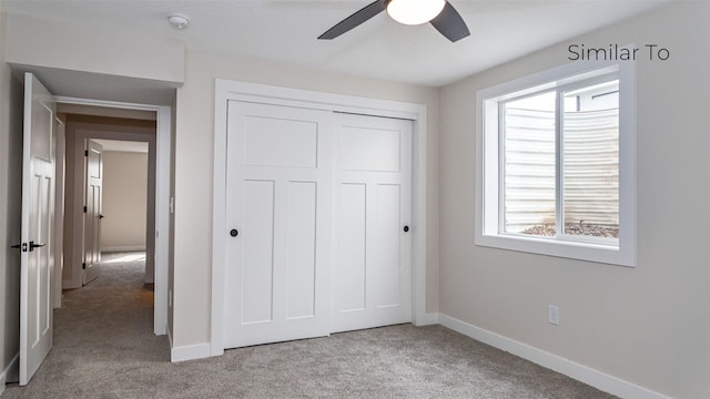 610 NW Georgetown Dr, Waukee, IA 50263 - unfurnished bedroom featuring carpet, multiple windows, a closet, and baseboards