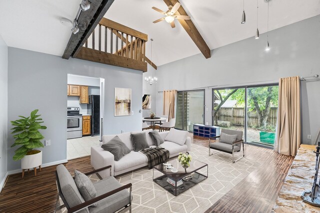 4633 Lockner Dr Unit 3, Urbandale, IA 50322 - living room featuring high vaulted ceiling, ceiling fan, a chandelier, beam ceiling, and light wood-style floors