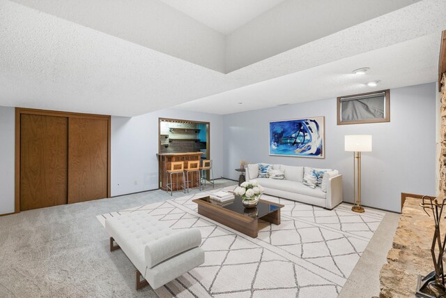 4633 Lockner Dr Unit 3, Urbandale, IA 50322 - living area with light colored carpet and a textured ceiling
