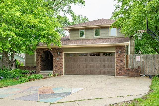 4521 77th St, Urbandale, IA 50322 - view of front facade with brick siding, concrete driveway, a garage, and roof with shingles
