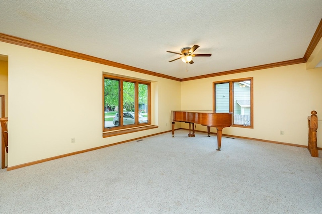 4521 77th St, Urbandale, IA 50322 - carpeted empty room with ceiling fan, baseboards, crown molding, and a textured ceiling