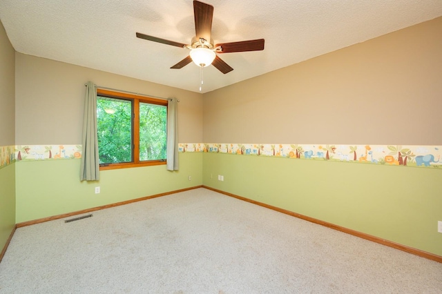 4521 77th St, Urbandale, IA 50322 - carpeted spare room with baseboards, ceiling fan, and a textured ceiling