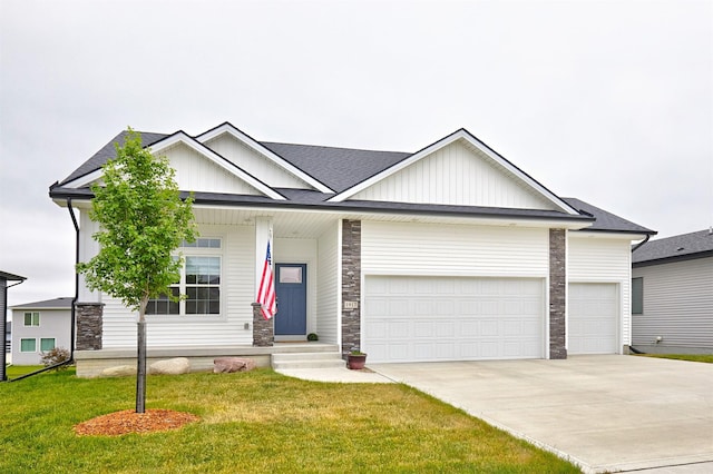 1917 Southbridge Dr, Adel, IA 50003 - view of front of property featuring board and batten siding, a garage, driveway, and a porch