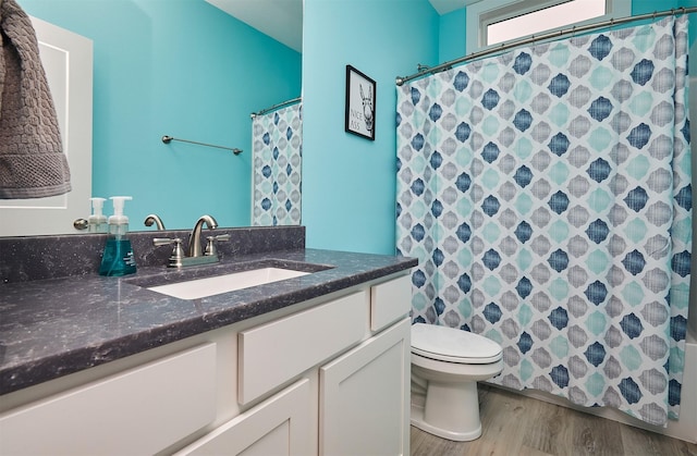1917 Southbridge Dr, Adel, IA 50003 - full bath featuring vanity, wood finished floors, and curtained shower