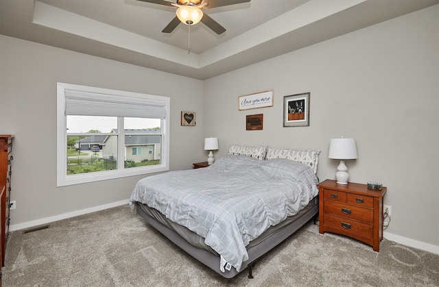 1917 Southbridge Dr, Adel, IA 50003 - carpeted bedroom featuring a raised ceiling and ceiling fan