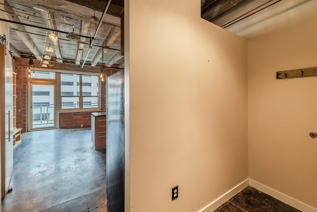 112 11th St Unit 506, Des Moines, IA 50309 - corridor with concrete flooring and baseboards