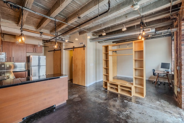 112 11th St Unit 506, Des Moines, IA 50309 - below grade area with freestanding refrigerator, baseboards, and an office area