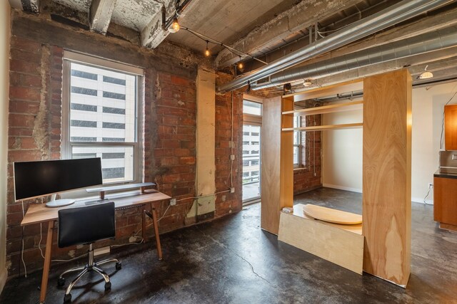 112 11th St Unit 506, Des Moines, IA 50309 - home office with finished concrete floors and healthy amount of natural light