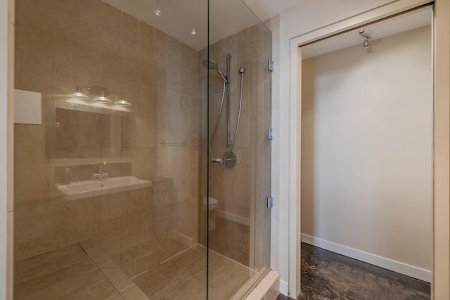 112 11th St Unit 506, Des Moines, IA 50309 - bathroom with a shower stall and baseboards