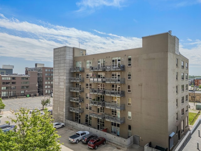 112 11th St Unit 506, Des Moines, IA 50309 - view of apartment building / complex featuring uncovered parking