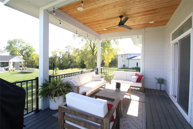 5015 153rd St, Urbandale, IA 50323 - wooden deck with an outdoor living space, a yard, and a ceiling fan