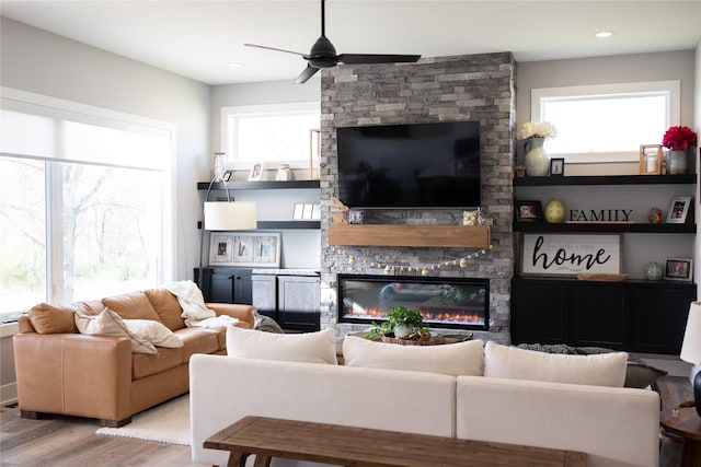5015 153rd St, Urbandale, IA 50323 - living room featuring a ceiling fan, wood finished floors, a fireplace, and recessed lighting