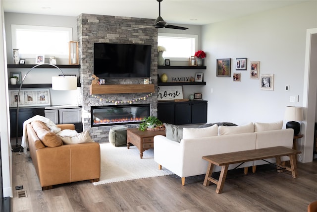 5015 153rd St, Urbandale, IA 50323 - living room with a ceiling fan, wood finished floors, and a large fireplace