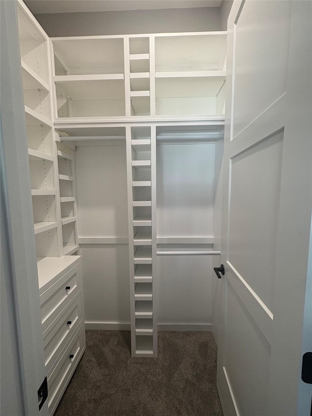 5015 153rd St, Urbandale, IA 50323 - walk in closet featuring dark carpet