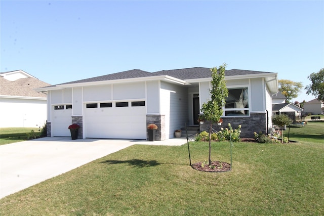 5015 153rd St, Urbandale, IA 50323 - view of front of home with an attached garage, stone siding, driveway, a front yard, and roof with shingles