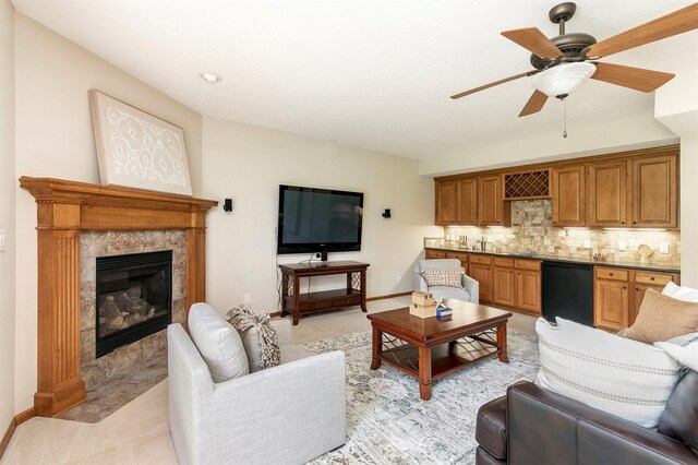 3605 151st St, Urbandale, IA 50323 - living room featuring a ceiling fan, a fireplace, and baseboards