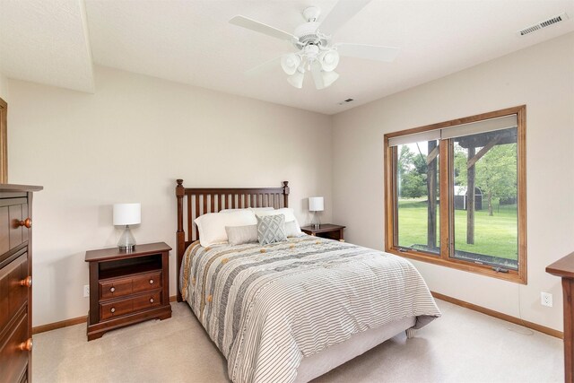 3605 151st St, Urbandale, IA 50323 - bedroom with light carpet, baseboards, and a ceiling fan