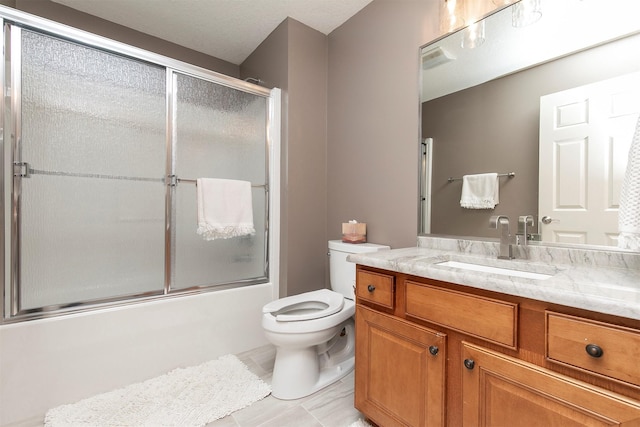 3605 151st St, Urbandale, IA 50323 - full bathroom featuring vanity, toilet, combined bath / shower with glass door, and tile patterned flooring