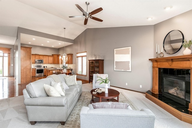 3605 151st St, Urbandale, IA 50323 - living area featuring plenty of natural light, a ceiling fan, a tiled fireplace, baseboards, and recessed lighting